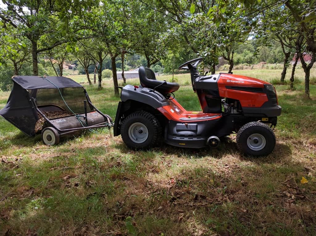 Riding mower on a large open lawn